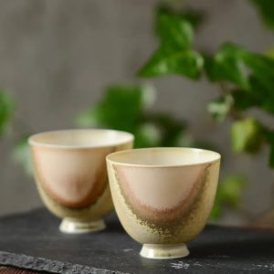 A pair of ceramic tea cups