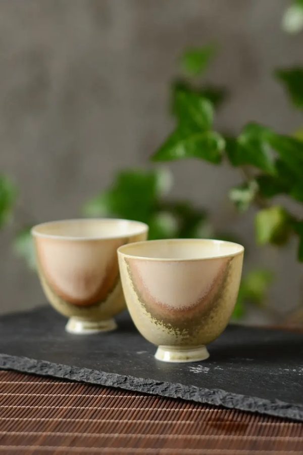 A pair of ceramic tea cups